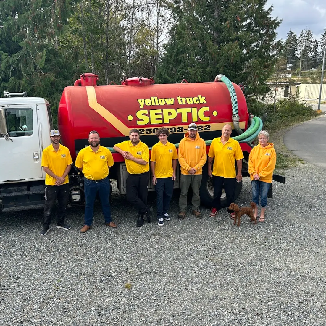 The Big Yellow Truck team in front of one of the trucks